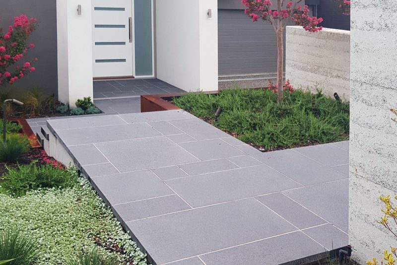 Charcoal concrete paving in an ashlar paving pattern at the entrance to a private residence | SVC Products